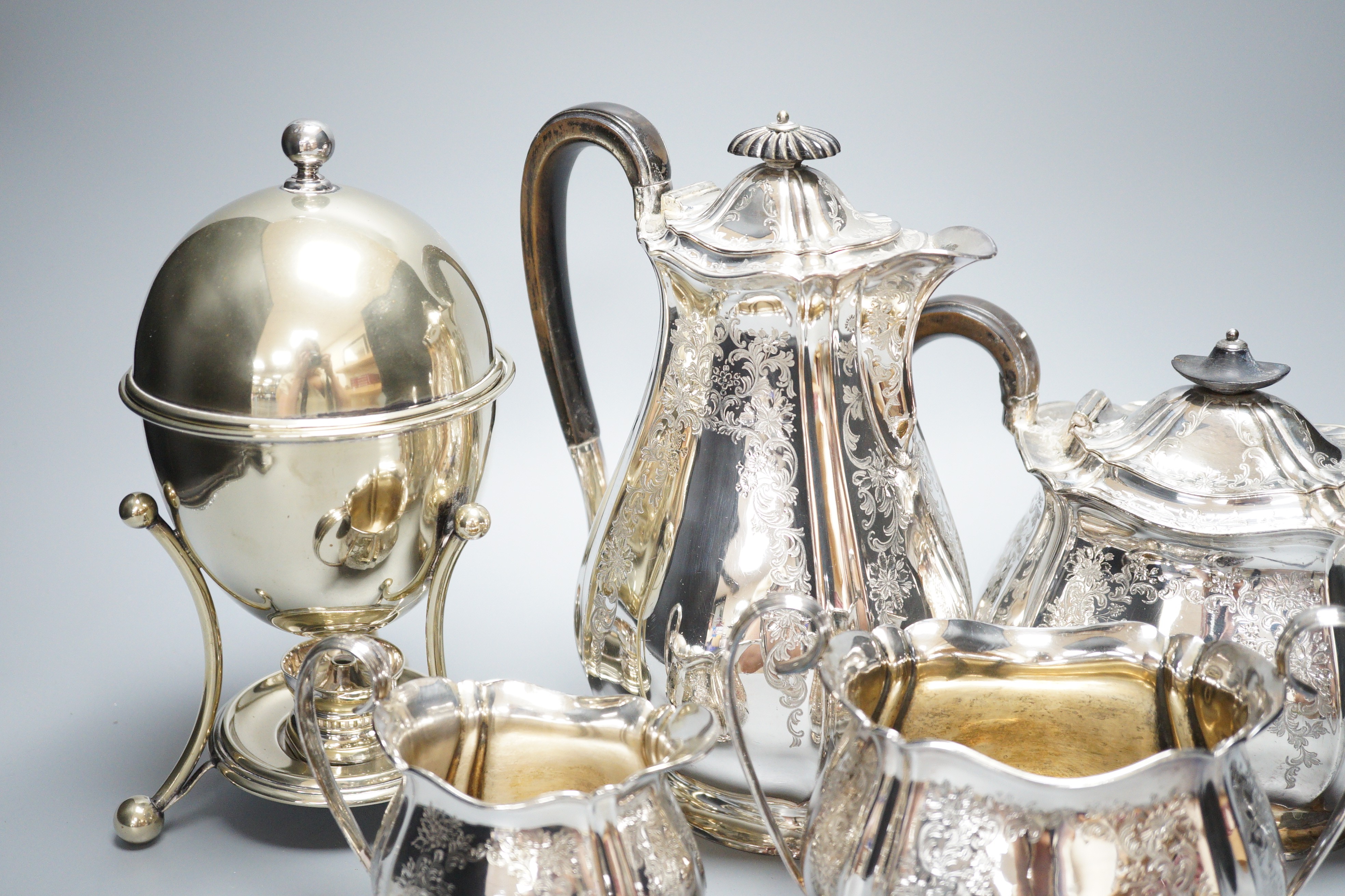 A canteen of silver plated cutlery, a four piece plated tea set and a plated egg coddler.